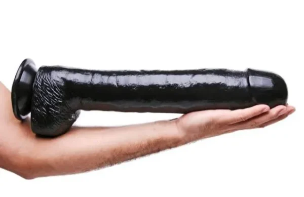 The Black Destroyer Huge Suction Cup Dildo on forearm