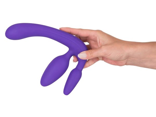 a hand holding Triple Teaser Vibrating Strapless Strap-On